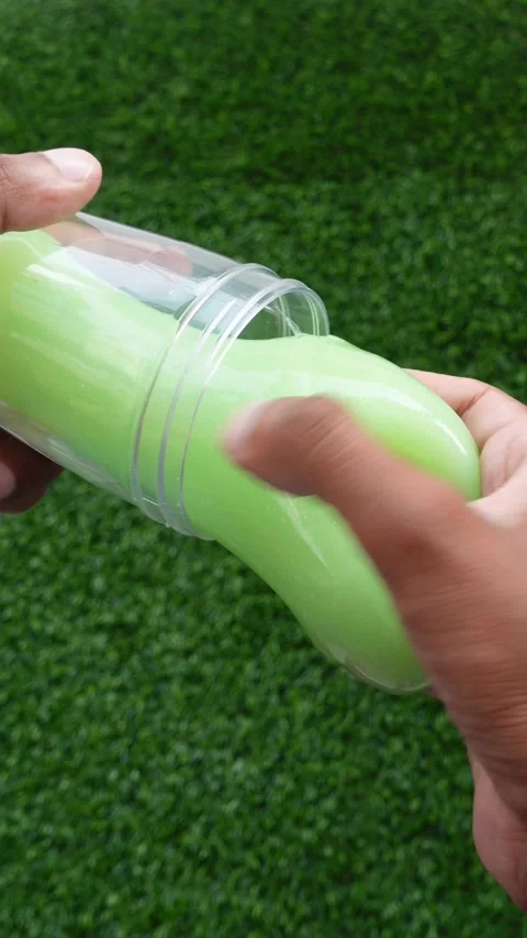 Removing Slime From A Transparent Container By Hand, First Person POV Stock Footage 345953161