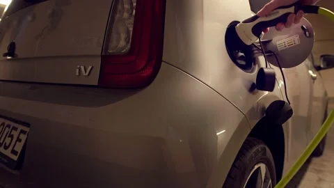 Removing the slipcover of the electronic plugin wire and push ing the plug Video stock 156945156
