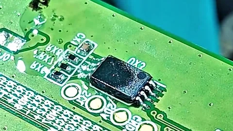 Removing SMD IC Chip from Smartphone PCB Under Microscope Stock Footage 333900091