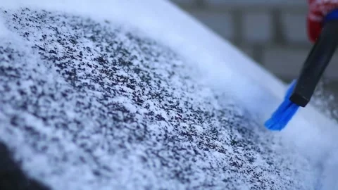 Removing Snow from Car with a Brush Stock Footage 305367609