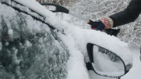 Removing snow from a car Stock Footage 117402458