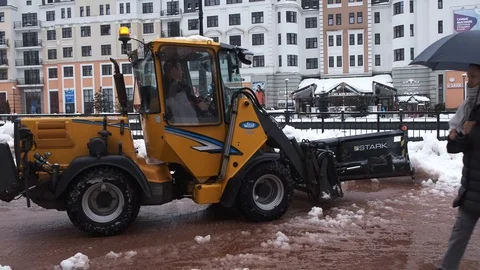 Removing snow with plow. Close up of iron snowplow pushing a lot of snow away. 動画素材 101241428
