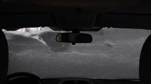 Removing snow from windshield Stock Footage