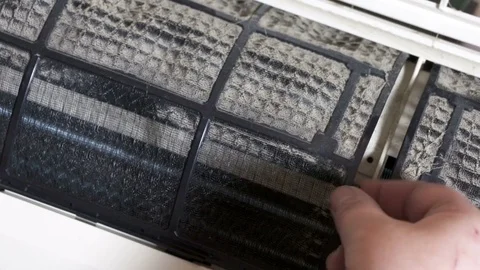 Removing split air conditioner dirty filters Stock Footage 75813079