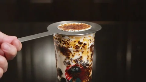 Removing Stainless Steel Ring From A Cup Of Refreshing Milk Tea With Creme Stock Footage 162940285