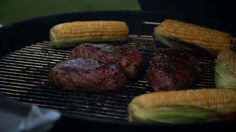 Removing steaks from grill Stock-Footage 132618155