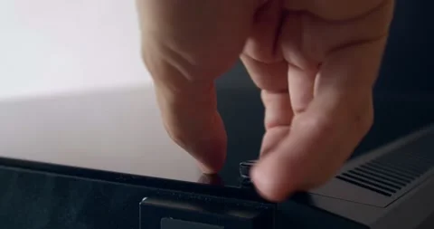 Removing tempered glass panel from PC Case - thumbscrews removal Stock Footage 131431312