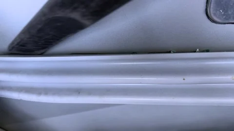 Removing tiny glass shards hidden within a car Stock Footage 321481082