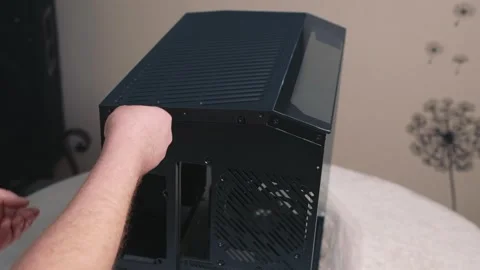Removing top cover of computer case during assembly preparation Stock Footage 324591959