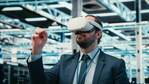 Removing VR goggles, finishing task and software developer in data center Stock Footage 329530573
