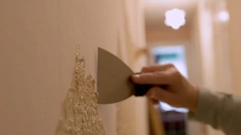 Removing Wallpaper In Preparation Of Re-Decorating Stock Footage 94612996