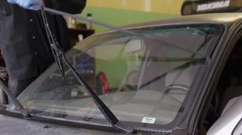 Removing weather seal from a windshield Stock-Footage 56960642