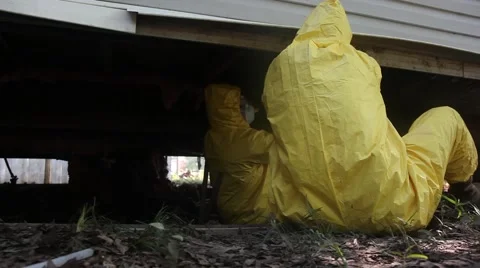 Removing Wet Insulation from Underneath Mobile Home Stock Footage 52995301