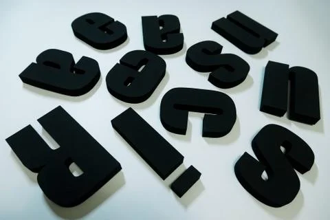 Renaissance text, extruded polystyrene letters painted in black paint. on a l Stock Photos