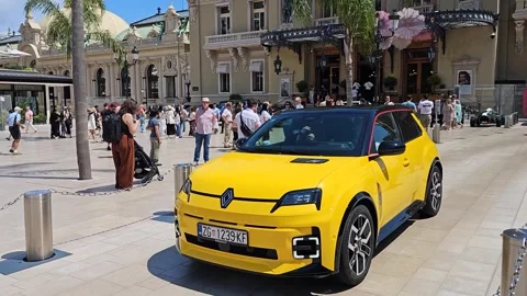 Renault 5 E-Tech Electric Drives Through Casino Square Stock Footage 309243621