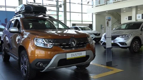 Renault Duster SUV in gold color with roof rack at Renault showroom. Krasnodar Stock Footage 161337486