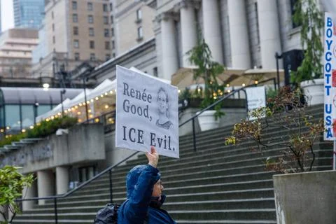 Rene Good ICE Evil protest sign with woman's portrait held at Vancouver Art.. Stock Photos