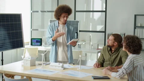Renewable Energy Developer Presenting Solar Power Project to Colleagues Video stock 230106229