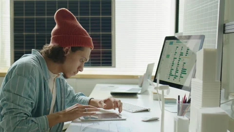 Renewable Energy Developer Using Tablet and Computer at Work Stock-Footage 230103590
