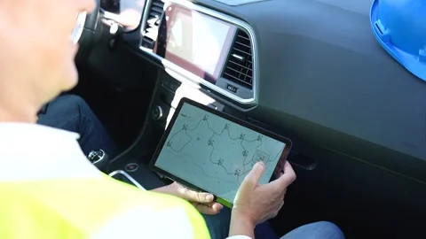 Renewable energy engineer planning work on a tablet Stock Footage 344564189