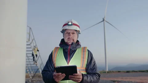 Renewable Energy Engineer Posing with Digital Tablet on Wind Farm Stock Footage 237242028