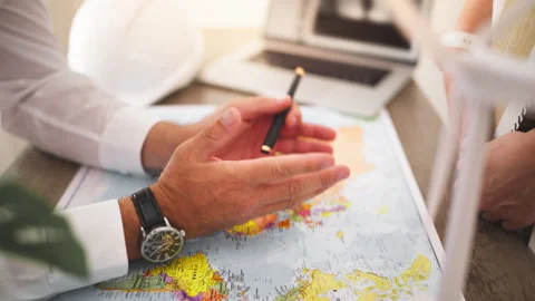 Renewable energy engineer present global wind power project on world map,di.. Stock Footage 346173432