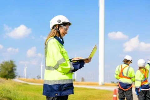 Renewable energy engineer working on wind turbine Stock Photos