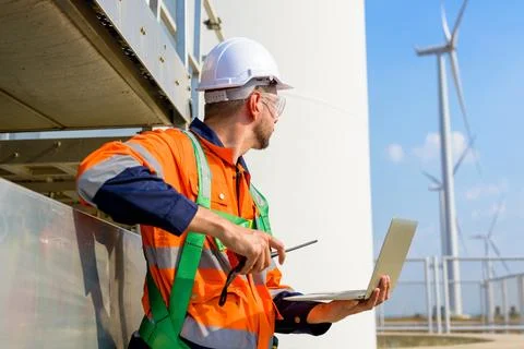 Renewable energy engineer working on wind turbine Stock-Fotos