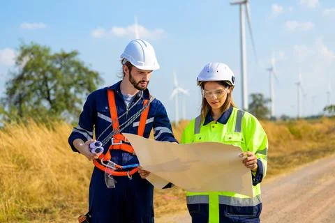 Renewable energy engineer working on wind turbine Stock Photos