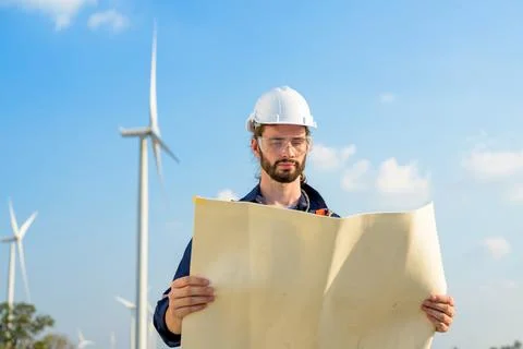 Renewable energy engineer working on wind turbine Stock Photos