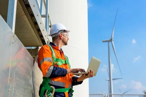 Renewable energy engineer working on wind turbine Foto stock