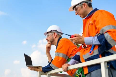 Renewable energy engineer working on wind turbine Stock Photos
