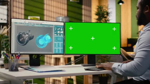 Renewable energy engineer works on wind turbine using green screen computer Stock Footage 315614271