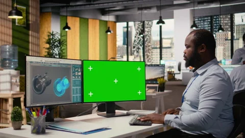 Renewable energy engineer works on wind turbine using green screen computer Stock Footage 316005391
