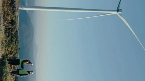 Renewable Energy Engineers Team Working at Wind Farm Stock Footage 237218204