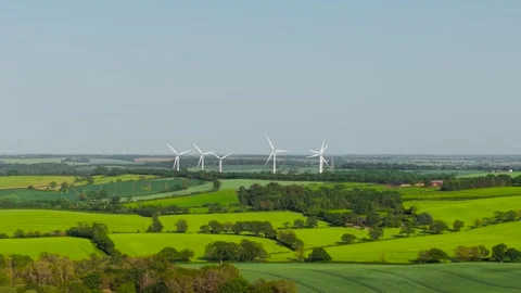 Renewable energy expanding across patchwork fields and countryside landscape 動画素材 338068473