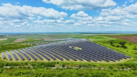 Renewable energy installation scene. Bright sky over sprawling solar array on Video stock 337903401