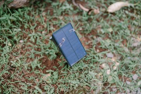 Renewable energy solution, Solar panel on lush grassy terrain Stock Photos