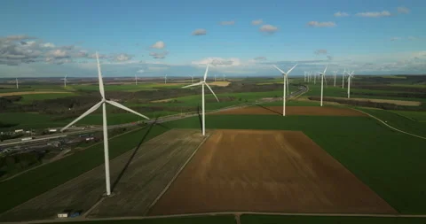Renewable energy source. Aerial view of wind turbines standing on the green 库存影片 239360928