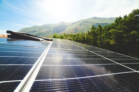 Renewable energy system with solar panel on the roof Stock Photos