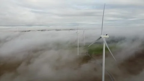 Renewable Energy Wind Farm Generating Power Above the Mist Stock Footage 322953630