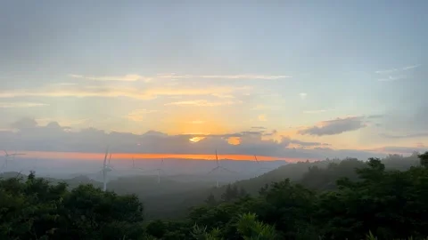 Renewable Energy Wind Farm at Sunset Above Misty Mountain Forest Stock Footage 339008623