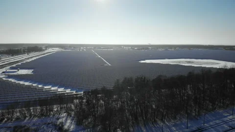 Renewable green energy and electrical engineering. Drone flies over a solar farm Stock Footage 217747149