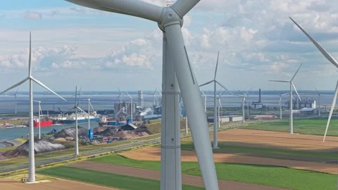 Renewable power production from rows of wind turbines, aerial countryside Stock Footage 315980804