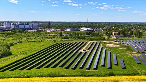 Renewable solar array bordering woodland and farmland, sustainable rural 스톡 동영상 332623604