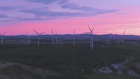 Renewable Wind Energy Farm with Multiple Turbines Against Dramatic Sunset Sky Stock-Footage 345114435