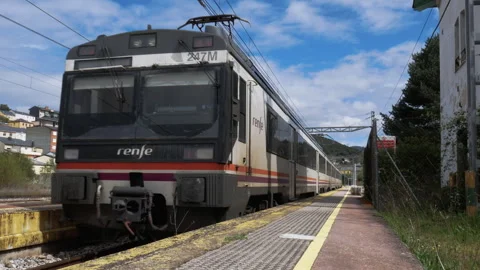 The Renfe Operadora Express regional train 247C completes its stop Stock Footage 306959621