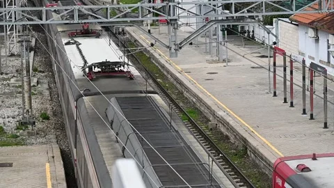 Renfe passenger train in motion at Collado Villalba station, 03/03/2026 Stock Footage 330053552