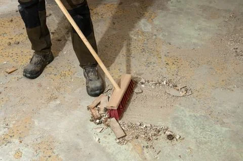 Renovation clean up in progress with broom Stock Photos