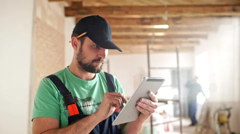 Renovation: man is measuring and taking notes Stock Footage